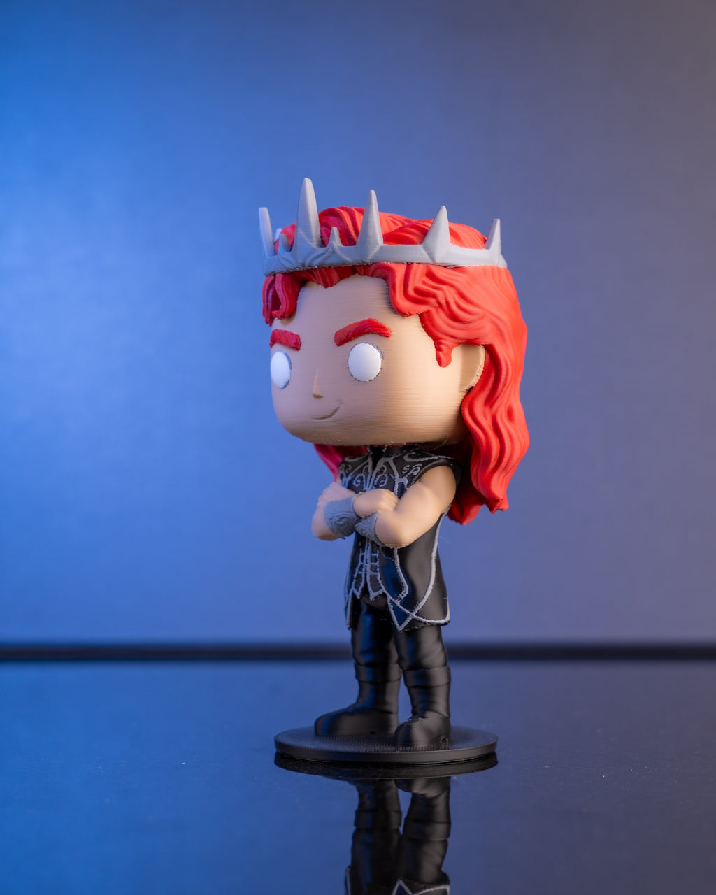 The Silver-Eyed King chibi figure with red hair and silver crown, hand-finished in Chur, Switzerland
