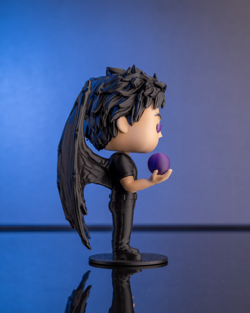 The Lord of Stars chibi figure with wings spread, hand-finished in Chur, Switzerland